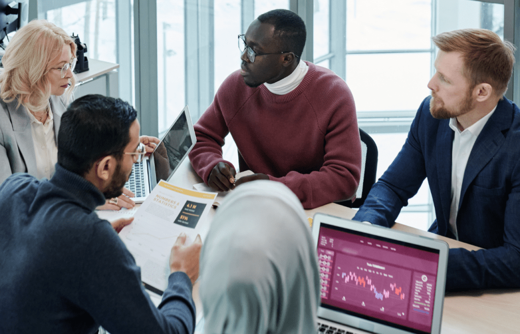 Discover Expert Management Consulting and Strategy Consulting 11 People having a discussion about their business status. Management Consulting and Strategy Consulting