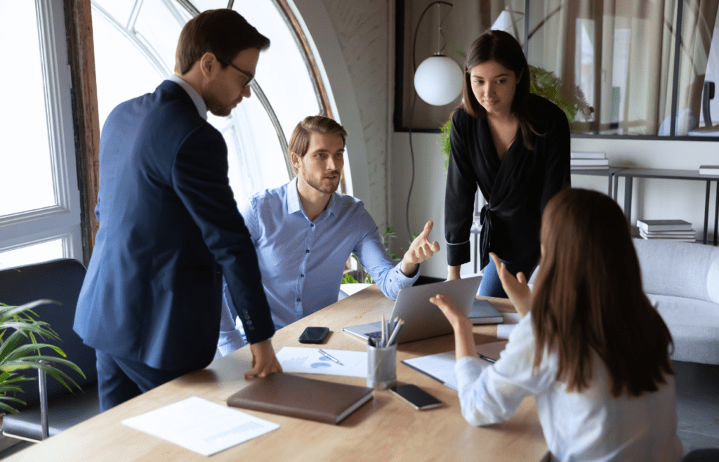 Discover Expert Management Consulting and Strategy Consulting 14 Business people engaged in team discussion. Management Consulting and Strategy Consulting