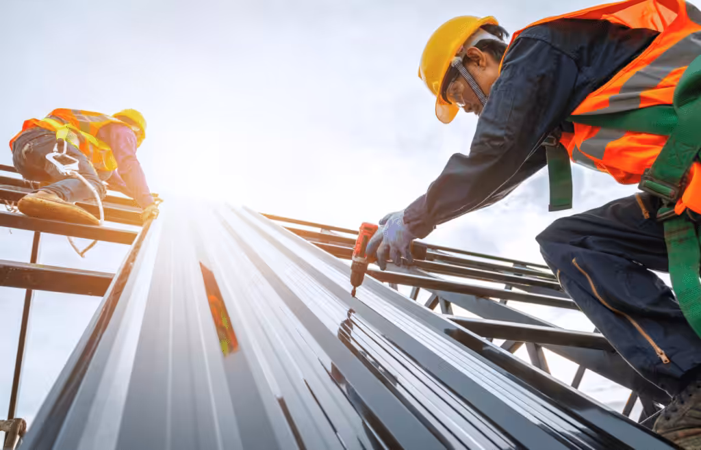 Construction workers installing roof. Construction and Contracting