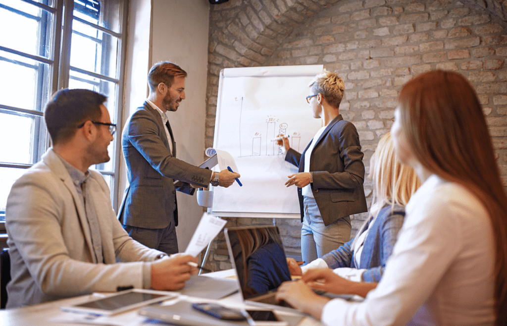 Management Consulting – A Straightforward Guide for Australian Business Owners 1 Business professionals having a meeting in a conference room. Management Consulting