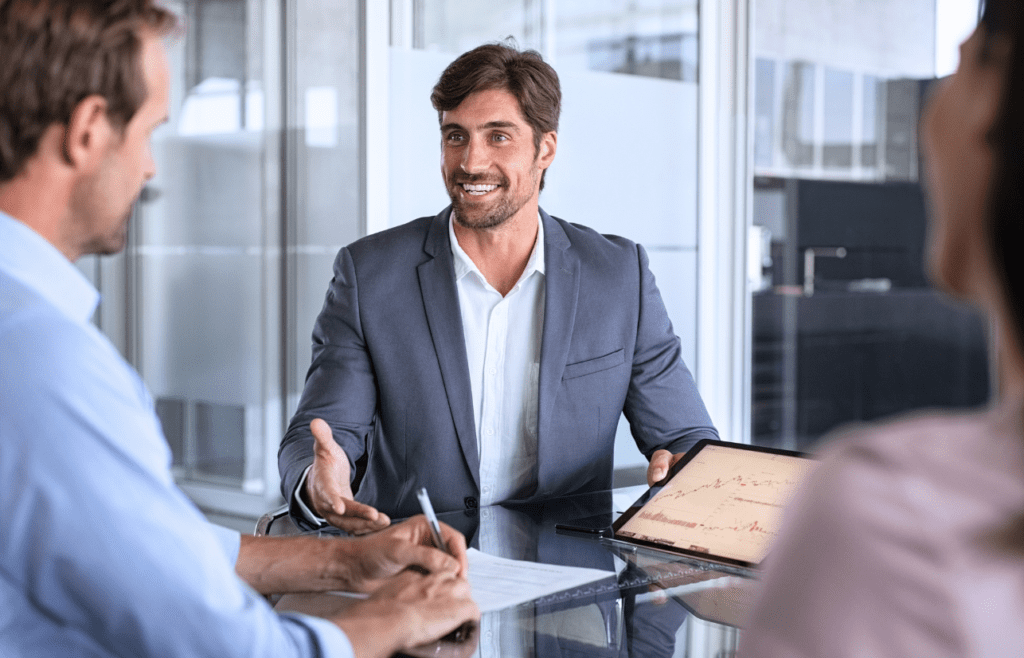Management Consulting – A Straightforward Guide for Australian Business Owners 5 Business professionals having a discussion with a consultant. Management Consulting