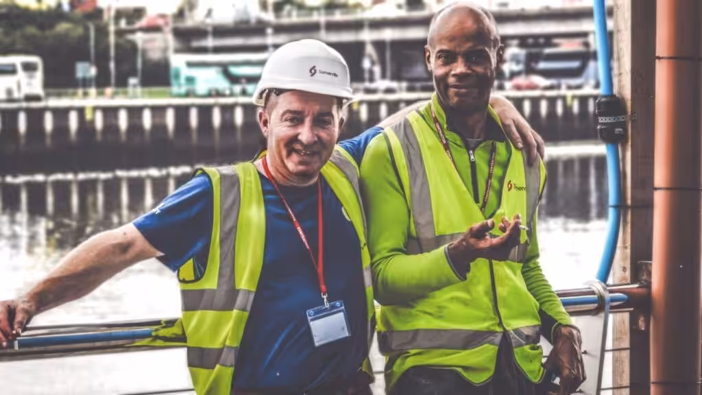 Construction owner and worker on site. Consultant Brisbane