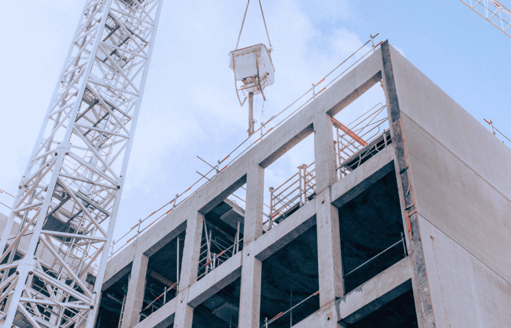 Building and crane tower at construction area. Construction and Contracting
