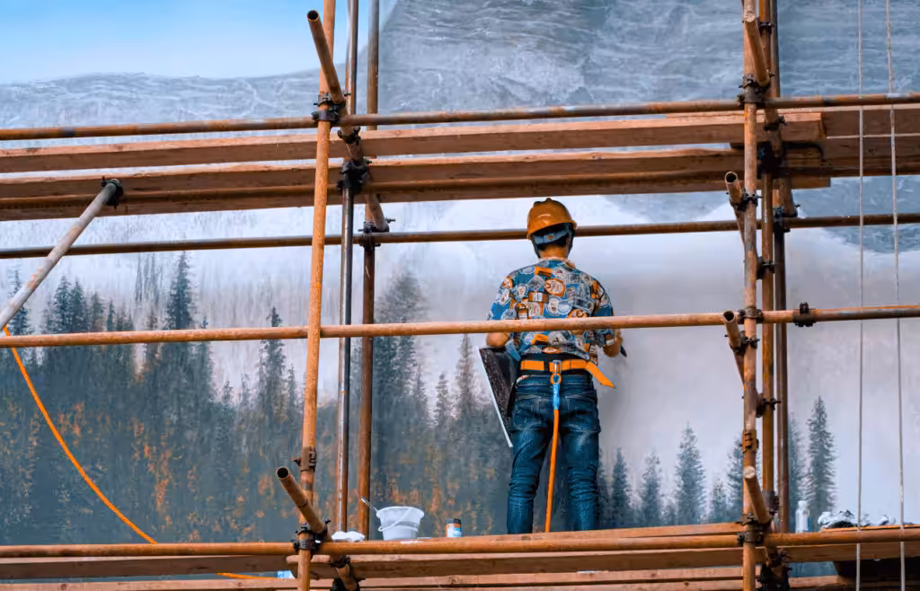 Construction Worker on a Scaffolding. Construction and Contracting