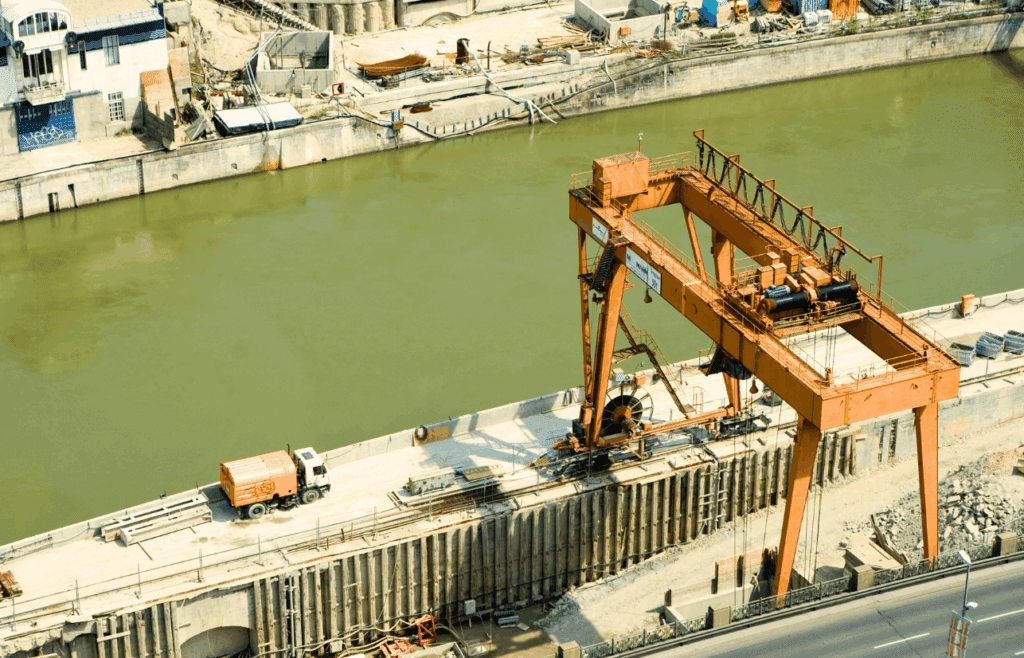 Construction crane working on a bridge. Construction and Contracting