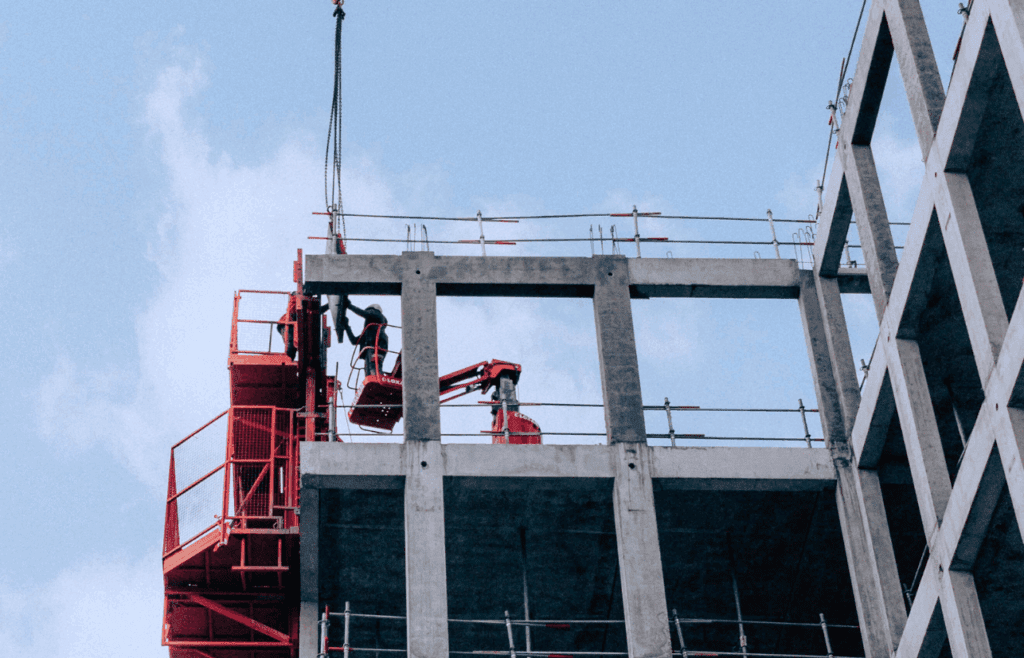 Group of construction workers on a building site. Construction and Contracting