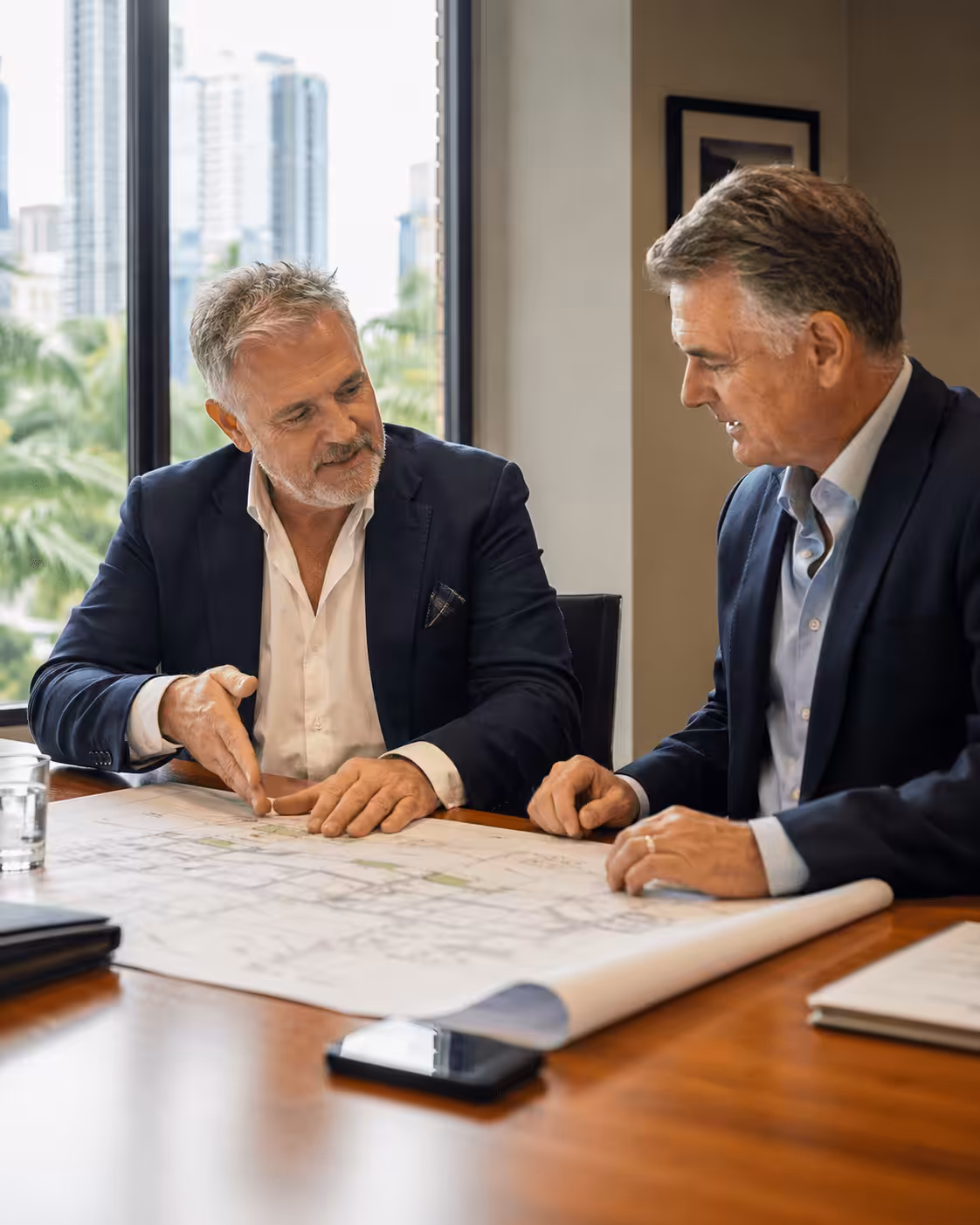 Management Consultant working with a Construction Business owner discussing project plans, Brisbane