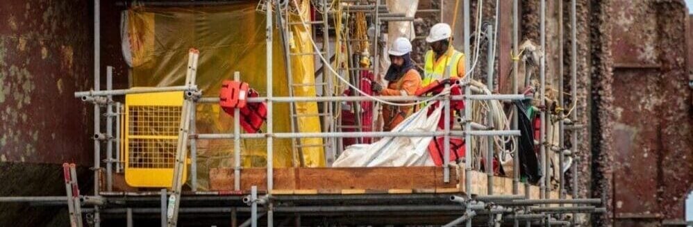 Men on scaffolding, construction risk, risk management and work health and safety risk
