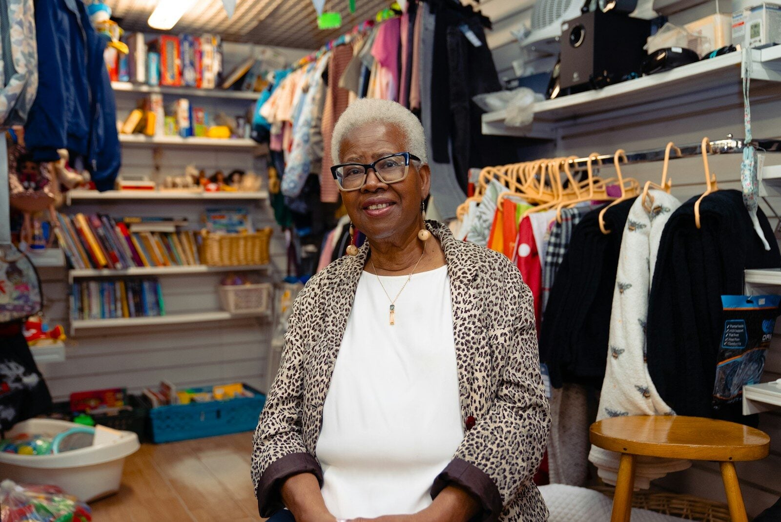 Sole Trader smiling in her dressmaking shop. Do Sole Traders Need a Director ID?