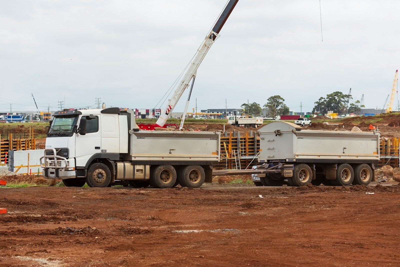 Truck with a crane on top of it. Construction Project Delivery