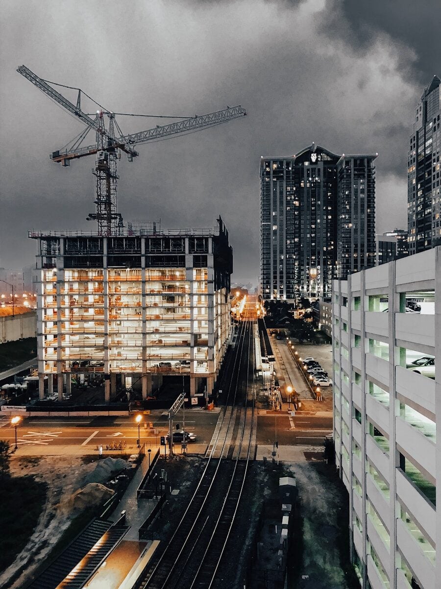 City buildings with crane on top. Construction Contract Types