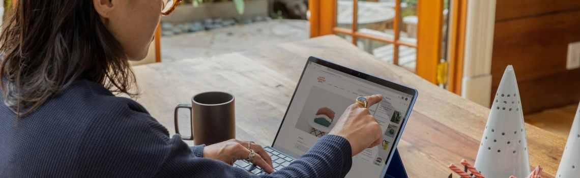 Businesswoman using a laptop. Custom Business Insights Blueprint