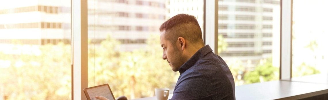 Businessman using laptop computer. Leveraging business advice for growth. Contract Review Lawyer