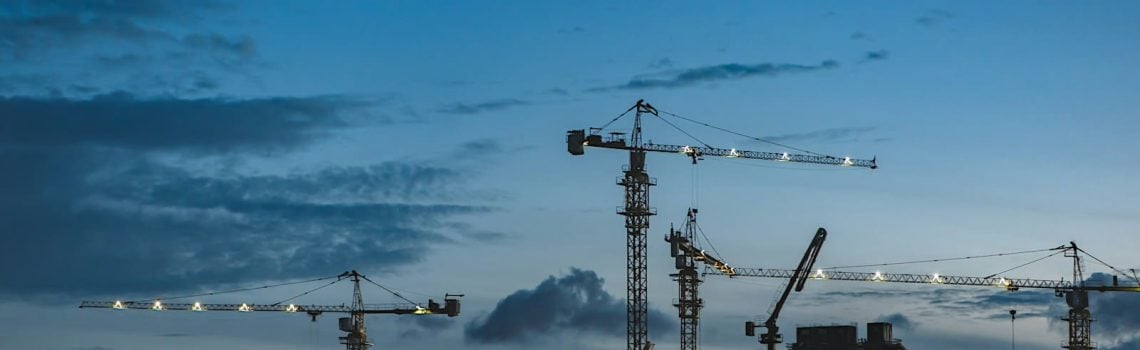 Cranes around a construction site. Contract Management for Construction Contracts in Australia, Construction Industry in Australia. Construction Industry Australia