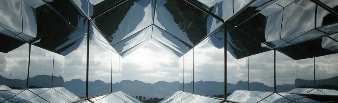 The reflection of the sky in the glass of a building. External Commercial Manager. Information Barriers in Australia. Terms and Conditions