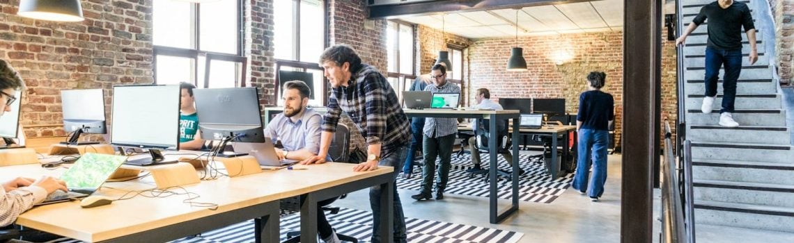 Startup employees discussing startup funding.