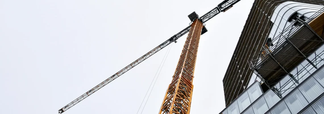 Crane above a building. Liquidated damages in construction contracts. Industries in Australia where we support our clients Crane above a building. Liquidated damages in construction contracts. Industries in Australia where we support our clients