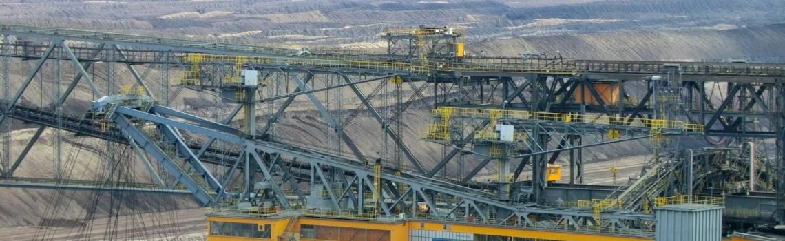 Mining equipment in a pit. Construction Law. Building Construction Lawyer. AS2124-1992. AS2124. Construction Lawyer Brisbane